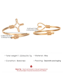 Detail showing two gold alloy wire-wrapped bracelets with star and heart charms dimensions