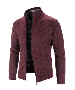 Detail of burgundy knit cardigan featuring a high collar and classic plaid fabric lining