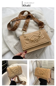 Detail view of khaki crossbody bag with V-shaped quilting and floral chain links