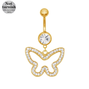 Macro detail of gold 316L surgical steel belly ring with crystal bowknot butterfly charm