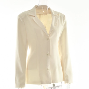 Detail of cream long sleeve blazer with three-button closure and slim fit tailoring