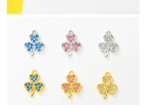Detailed view of alloy clover pendants with sparkling blue pink and white rhinestones