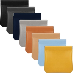 Mini leather cosmetic pouch set in eight colors with automatic spring closure feature
