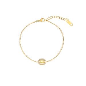 Detail of adjustable gold bracelet with yellow teardrop stone and lobster clasp