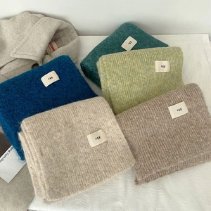 Soft wool blend egg knit scarves in multiple pastel colors for winter warmth