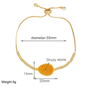 Detail showing dimensions of adjustable gold chain bracelet with orange druzy stone