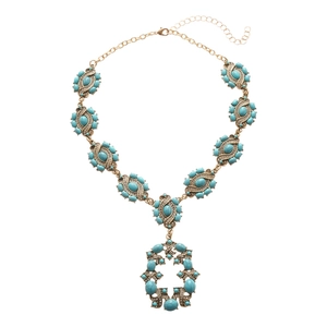 Vintage gold necklace featuring turquoise resin stones and geometric hollow pendant