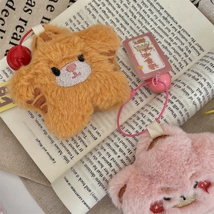 Detail of cute plush bear keychains with fine embroidery and soft colorful lanyards