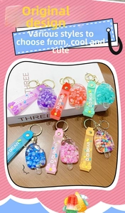 Detailed view of popsicle-shaped acrylic keychains with colorful beads and silicone straps