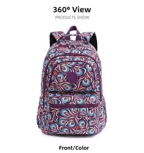 Front view showing multiple zip compartments and colorful floral patterns on the backpack