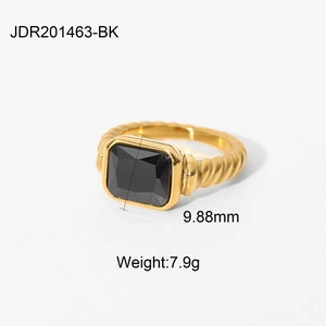 Detailed macro of gold-plated twisted ring with a 9.88mm square black zircon gemstone