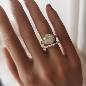 Detail of 18K gold plated signet ring with micro-pave crystals and stackable band