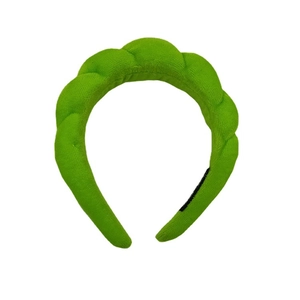 Thick braided sponge headband in bright green fabric with stylish twisted design