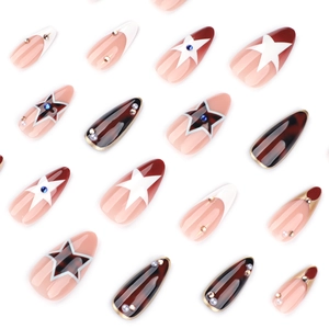 Almond-shaped tortoise shell press-on nails with red star patterns and pearl accents
