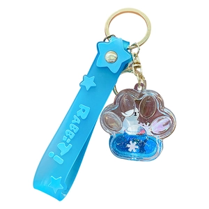 Cute polar bear liquid quicksand keychain with blue cat paw pendant and PVC wrist strap