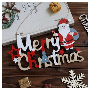 Detailed view of a Merry Christmas wooden sign with Santa on a festive tabletop