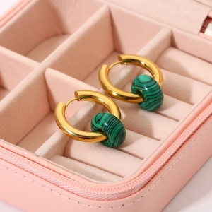 Detail view of 18K gold stainless steel hoop earring with green striped stone pendant