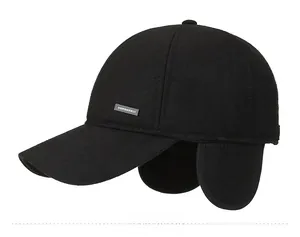 Detail of winter baseball cap showing ear flaps, wool fabric texture and metal SPORTS badge