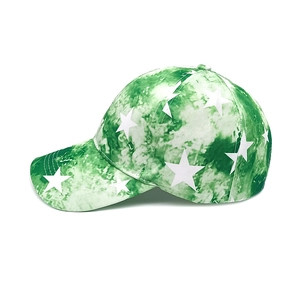 Green tie-dye baseball cap with white star prints and curved brim for sun protection