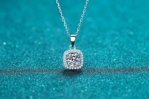 Macro shot of S925 silver square halo pendant necklace with sparkling round center stone