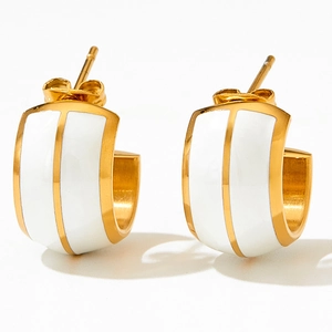 Gold and white enamel C-shape hoop earrings in a minimalist geometric metal style