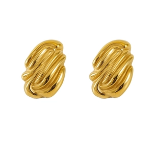 Macro shot of 18K gold plated stainless steel earrings with organic pleated texture