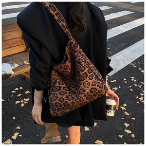 Street style view of the large leopard print tote bag with soft suede texture finish