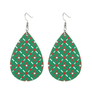 Detail of teardrop leather earrings featuring a green and red geometric grid pattern
