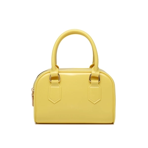 Detail of a bright yellow Boston style jelly bag with high-gloss finish and handles