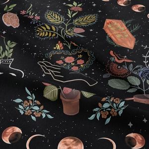 Detailed close-up of bohemian wall tapestry featuring moon phases, crystals, and botanicals