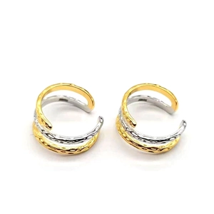 Detail of S925 sterling silver ear cuff with hammered texture and bicolor layered design