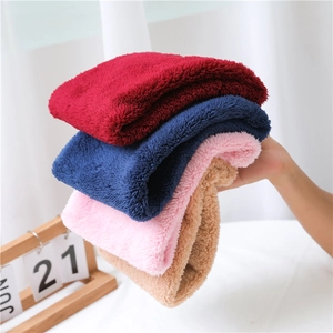 Winter thermal coral fleece neck gaiter scarves in four solid colors held in hand