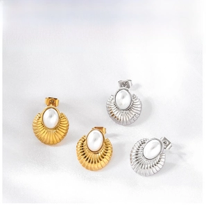 Detail view of oval pearl stud earrings with shell texture in gold and silver plating