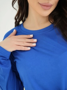 Close-up of the smooth navy blue long-sleeve pajama top with high-quality knit texture