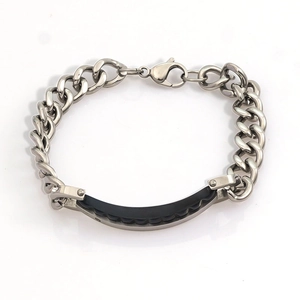 Polished silver stainless steel Cuban link bracelet with black textured rubber accent