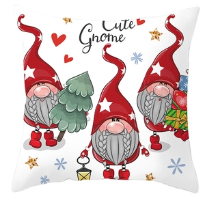Detail of Christmas pillow cover featuring cute red gnomes and festive holiday patterns