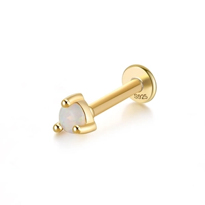 Macro detail of S925 sterling silver opal stud earring with gold finish and 3-prong setting
