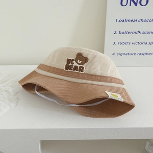 Kids corduroy bucket hat with bear embroidery and contrast colors in beige and caramel