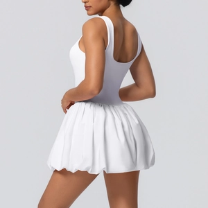 Detail of white double-layer athletic dress with built-in shorts and bubble hem design