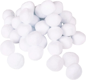 Close-up of soft white plush pom poms for Christmas DIY crafts and festive ornaments