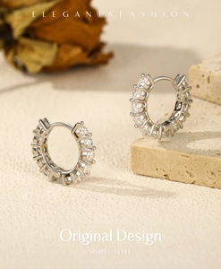 Elegant s925 silver hoop earrings featuring VVS1 moissanite stones on textured stone base
