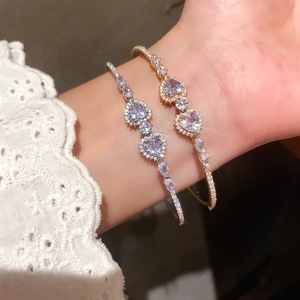French style open heart bangle with sparkling zircons in gold and silver finishes