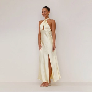 Detail of satin halter neck dress with cutout chest and high side slit design