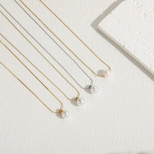 Elegant gold and silver titanium steel necklaces with round white pearl pendants