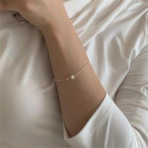 Minimalist S925 sterling silver beaded snake chain bracelet worn on a model wrist