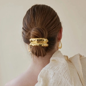 Golden hammer texture metal hair ring with irregular lava pattern for elegant ponytails