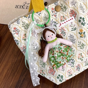 Cute floral doll keychain plush pendant with green beads and white polka dot lace ribbon
