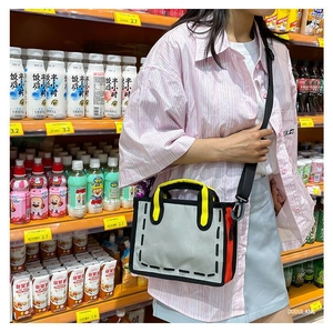 Detail of 2D comic style canvas tote bag with bold black lines and yellow handle