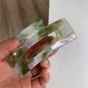 Iridescent green acetate hair claw clip with geometric square design for women