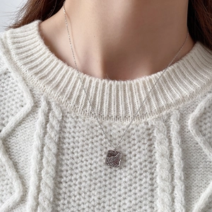 Minimalist S925 silver leaf textured square pendant necklace on white knit sweater